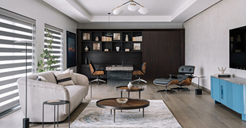 办公室室内装修：双倍高度的溢出区域为混凝土的连续性提供了空间休息